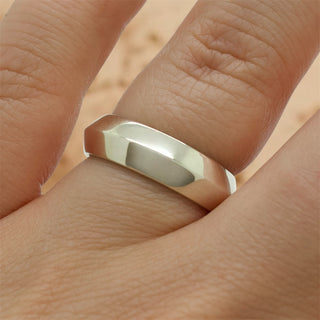 Silver 6mm faceted band ring, smooth inner band and angled top facets