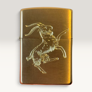 Brushed brass Zippo-style lighter with hand-engraved standing goat design