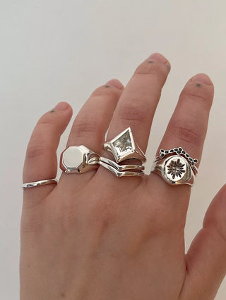 Kite Signet Ring by Emily Proudfoot Jewellery, Yorkshire jeweller, handcrafted with tapered band and bezel-set Amethyst, Topaz, or Black Onyx, unisex design, personalisable with interior engraving or custom centre stone.