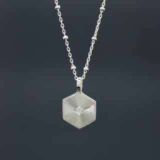 Clear Diamond Illumination Pendant - Hand engraved hexagon pendant with guilloché sunray pattern, stone set eye and milgrain detail - Emily Proudfoot