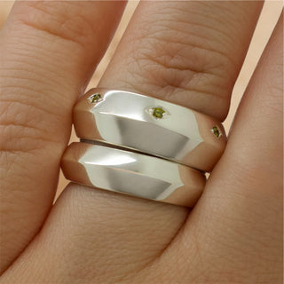 Silver 6mm faceted band ring stacked with 7mm Wide metal knife edge band ring with green diamond eye eternity settings with mirror polished finish 