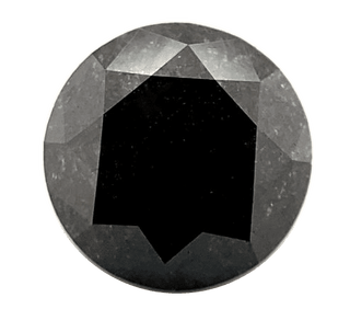 Round faceted black gemstone with silvery facets