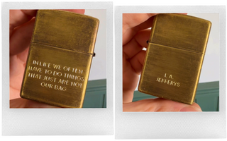 Brass Zippo lighter with engraved text on the side, held in hand