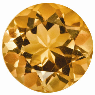 Round faceted golden yellow gemstone with warm highlights