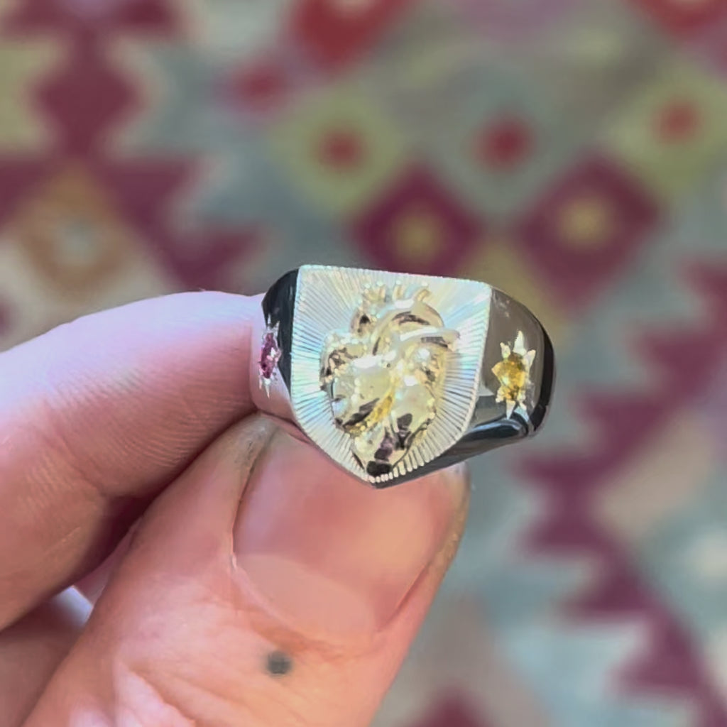 Silver heraldic shield signet ring with hand engraved bright cut details, anatomical human heart, 8 point star set pink topaz tourmaline sapphire and orange citrine - Emily Proudfoot Jewellery - British jewellery designer 
