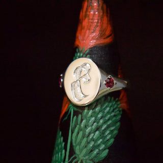 Silver gothic letter signet ring with engraved letter and red marquise stone